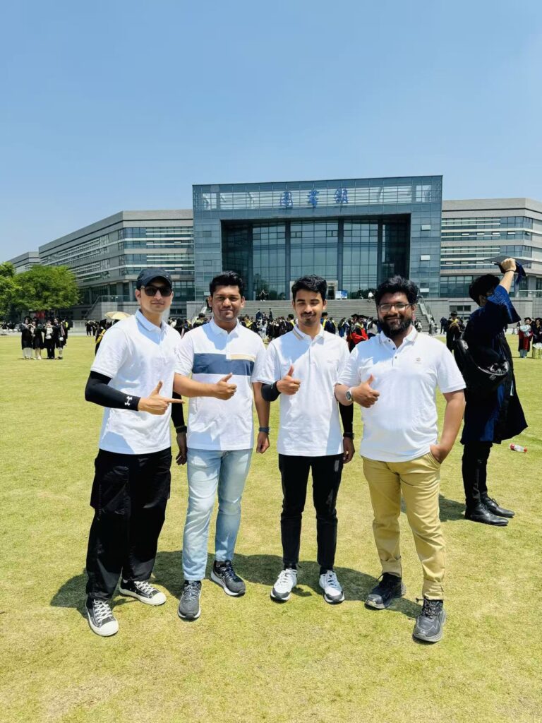 PrimeLink team together in matching shirts in China