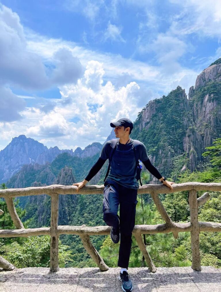 PrimeLink team member at a mountain viewpoint in China